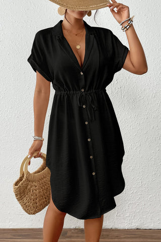 A woman wearing a Black-Short-Sleeve-Shirt-Dress.