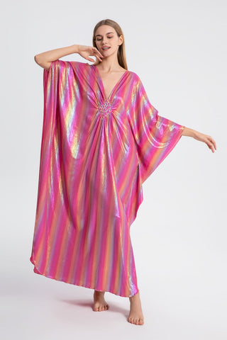 A woman wearing a pink Sparkly Glitter Kaftan Dress.