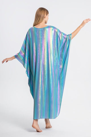 A woman wearing a short sleeve sparkly glitter maxi kaftan dress.